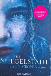 Justin Cronin - Die Spiegelstadt Das Cover des Romans "Die Spiegelstadt" von Justin Cronin zeigt die Protagonistin Amy.