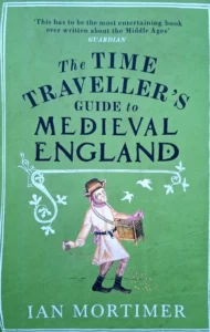 Das Cover des Romans "The Time Traveller’s Guide to Medieval England" von Ian Mortimer zeigt die stilisierte Darstellung eines Bauerns der Korn aussäht.